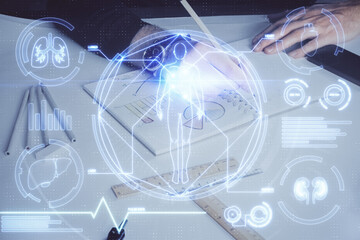 Man's hands working with notes background. Scientist checklist or entry data, research and experiment concept.