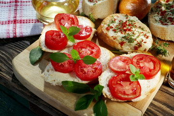 top-view of a  healthy sandwiches with  tomato and basil ,savory, olive oil on table.