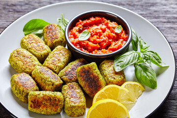 baked broccoli tots on a plate, top view