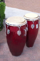 Vintage Red Drums on Sidewalk