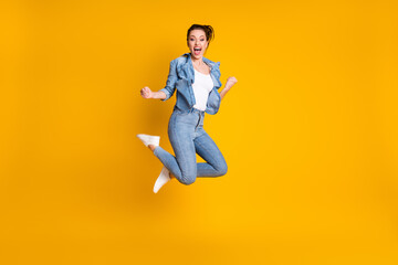 Fototapeta na wymiar Full length body size view of her she attractive glad cheerful cheery funky girl jumping rejoicing having fun great news isolated bright vivid shine vibrant yellow color background