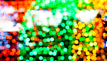 unfocused blurred sparkling christmas multicolored lights with bokeh effect