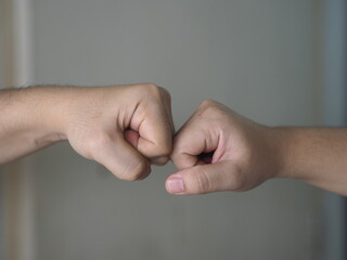 Two woman Alternative handshakes Fist collision Bump greeting in the situation of an epidemic covid 19, coronavirus