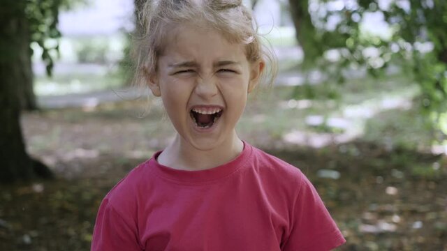 Child Shouting Loud. Portrait of Shocked, Angry and Emotional Little Girl. Young Angry Girl Yelling Screaming Slow Motion. Upset Child Scream Loudly. Adhd Attention Deficit Hyperactivity Disorder.