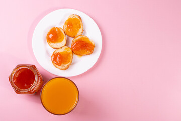 orange jam toasts and drink as breakfast concept