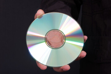 CD or DVD. Black Background.