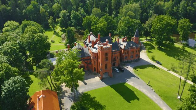 Beautiful medieval red Sangaste Castle (German: Schloss Sagnitz) and it's surroundings in country of Estonia.