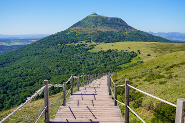 wooden pathway long staircase for access on hight mountain Puy de Dôme volcano in Auvergne france