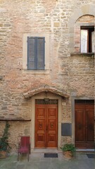 Fototapeta na wymiar Ancient buildings in the city centre of the beautiful Cortona, Italy.
