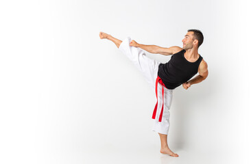 karateka practicing kata with white background