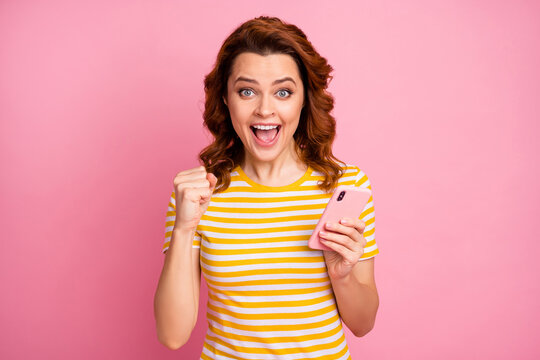 Close-up portrait of her she nice attractive lovely pretty charming glad lucky cheerful cheery wavy-haired girl using cell having fun isolated over pink pastel color background