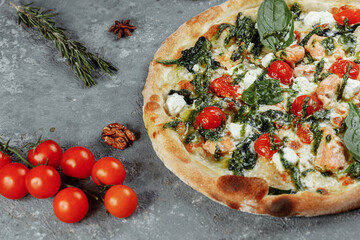 Real Italian delicious pizza with salmon and cheese