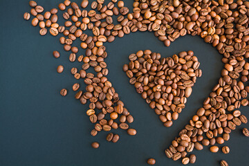 Heart shaped coffee beans on a dark background