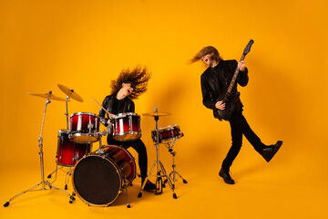 Full size photo of crazy funny two people famous punk youth artist man play bass guitar girl drum...