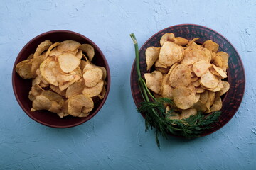Potato Chips on an old wooden table. Close up food photo