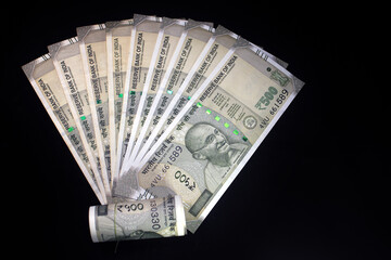 Indian currency. 500 rupee note. Five hundred rupee Indian currency isolated on black background.