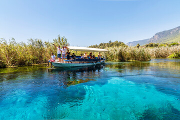 Fototapeta premium Taking tour on Azmak Stream in Akyaka Village. Akyaka is popular tourist destination in Turkey.