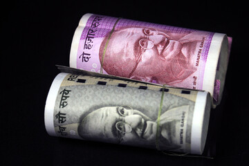 New Indian currency. 500, and 2000 rupee notes. Indian currency isolated on black background.