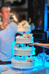 Delicious Wedding Cake at the party. Smoke and fire effects.