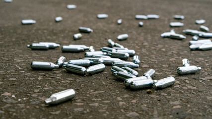 Lots of Discarded Nitrous Oxide gas canisters