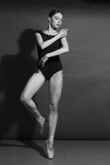black and white vintage dramatic portrait of a dancing girl-ballerina