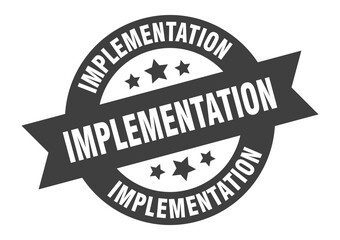 Obraz premium implementation sign. round ribbon sticker. isolated tag