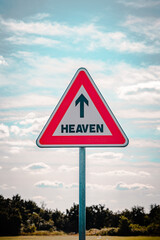 Roadsign with an arrow inside pointing to heaven