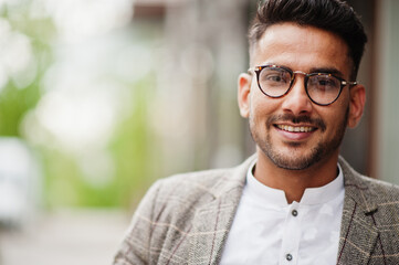 Stylish pakistani man wear in eyeglasses and jacket. - obrazy, fototapety, plakaty