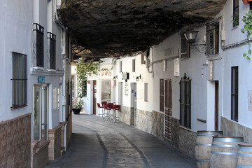 Houses nestled in the rock in Setenil de las Bodegas. The famous street `
