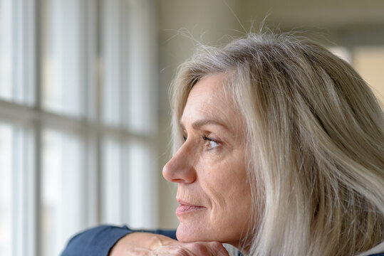 Pretty thoughtful woman with serious expression