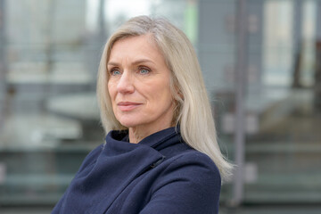 Serious professional woman staring at camera