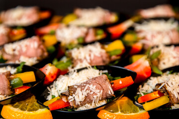 canapes of rolled meat with vegetables