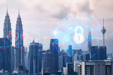 Padlock icon hologram over panorama city view of Kuala Lumpur to protect business, Malaysia, Asia. The concept of information security shields. Double exposure.