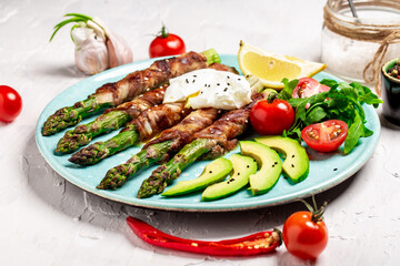 Green asparagus with poached egg on a plate. balanced food, recipe background