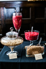 brightly colored candy in jars on table for event