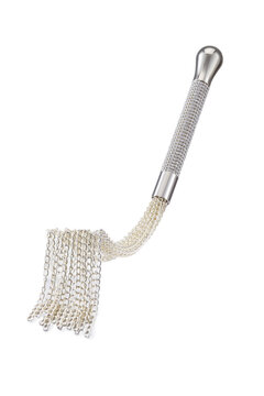 Detailed shot of metal whip with fringe of silver chains and smooth handle with rhinestones. The tool for erotic games is isolated on the white background. 