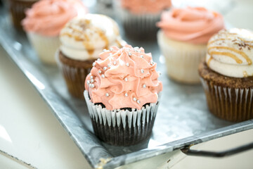close up of elegant cupcakes on table for event