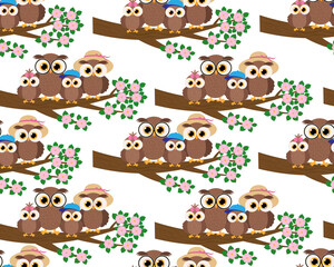 Fototapeta premium Seamless pattern Cute owls family sitting on a tree branch vector illustration