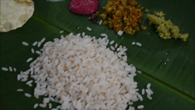 Video of pouring Parippu, south indian dish to traditional Onam Sadhya.