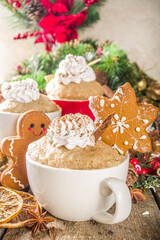 Christmas traditional gingerbread in mug. Simple and fast recipe idea for Christmas breakfast, mugcake in microwave with traditional winter spices, on xmas decorated wooden background copy space