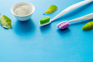 Herbal organic tooth powder with toothbrush close up