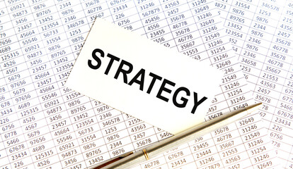 The inscription on a piece of paper is fixed on a tablet for the letter STRATEGY.