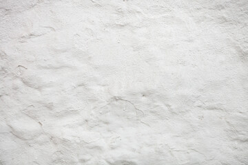 White concrete wall texture with cracks and scratches. Fragment of painted wall, for background or texture.