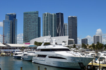 Fototapeta na wymiar Luxury condo and office building towers overlooking a marina on the downtown Miami,Florida waterfront.