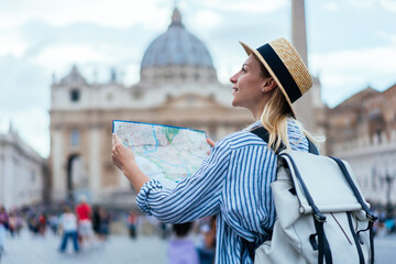 Caucasian traveller with touristic backpack enjoying sightseeing time for exploring Vatican city...