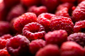 Fresh and sweet red raspberries texture. fruit pile background