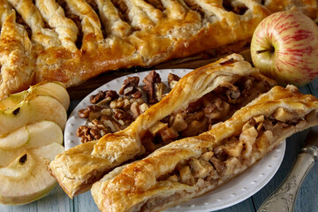 Pieces of delicious homemade pie with apples and nuts