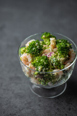 Salad with Shrimps, broccoli , onion and quinoa. Copy space