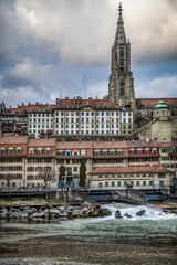 Minster of Bern in the down town rises above the Aare river