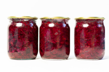Canned Ingredients for borscht in glass jar as preserves on white background 